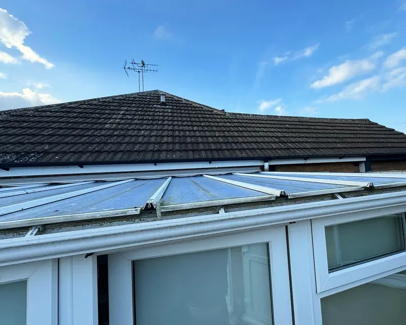 Glass lean-to roof on a bungalow before replacement